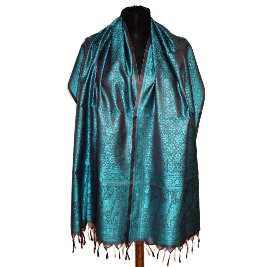 Teal patterned scarf on a mannequin against a white background