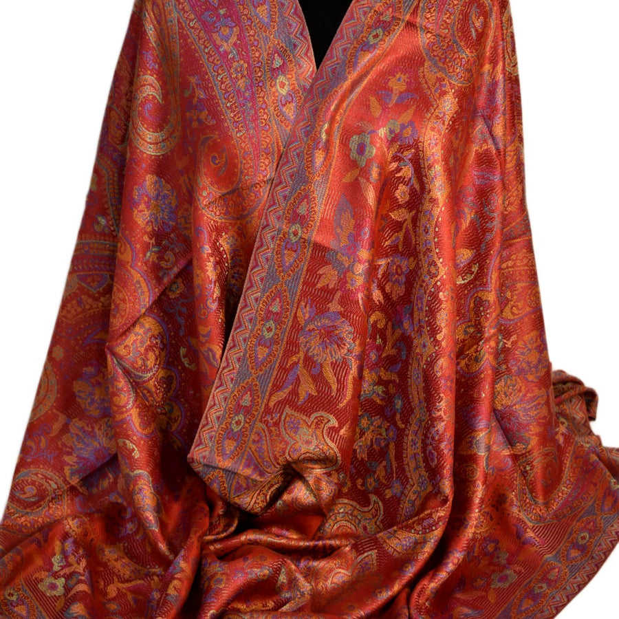 Red and orange handwoven pure silk shawl with intricate designs on a white background