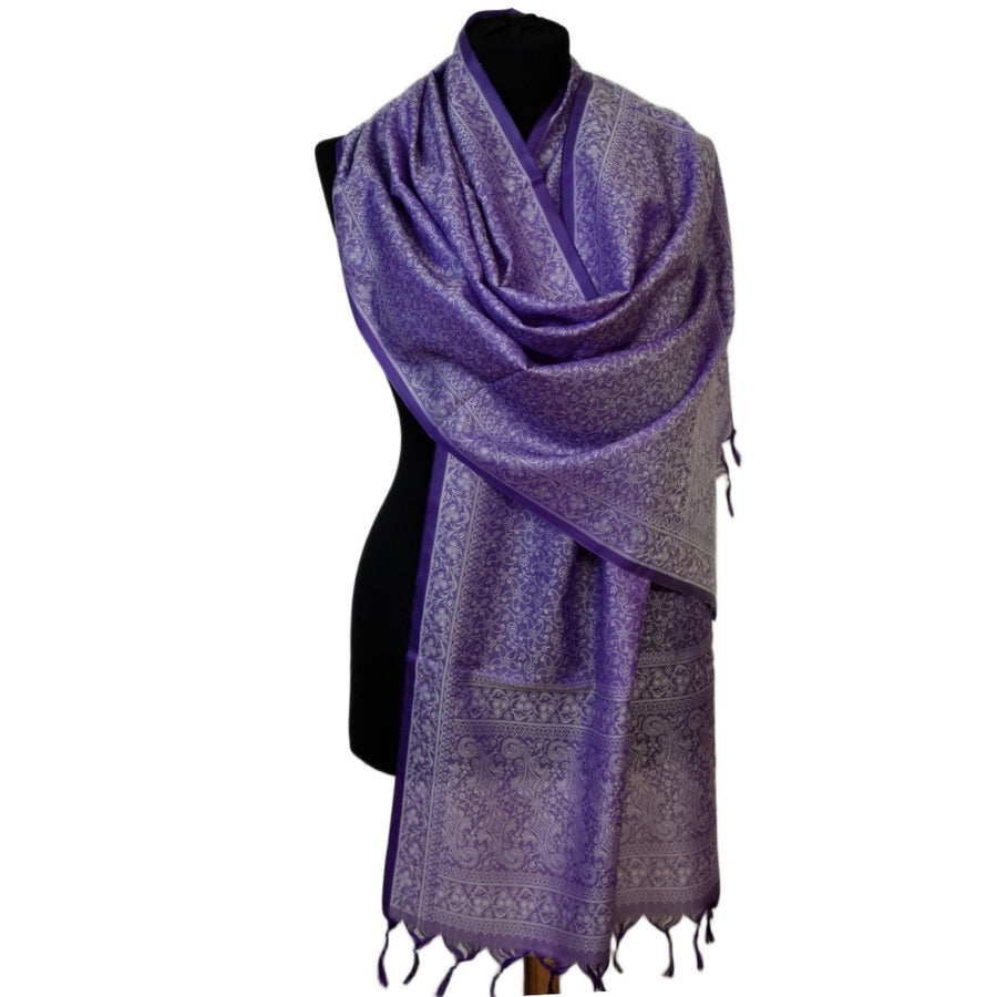 Purple patterned scarf on a mannequin against a white background
