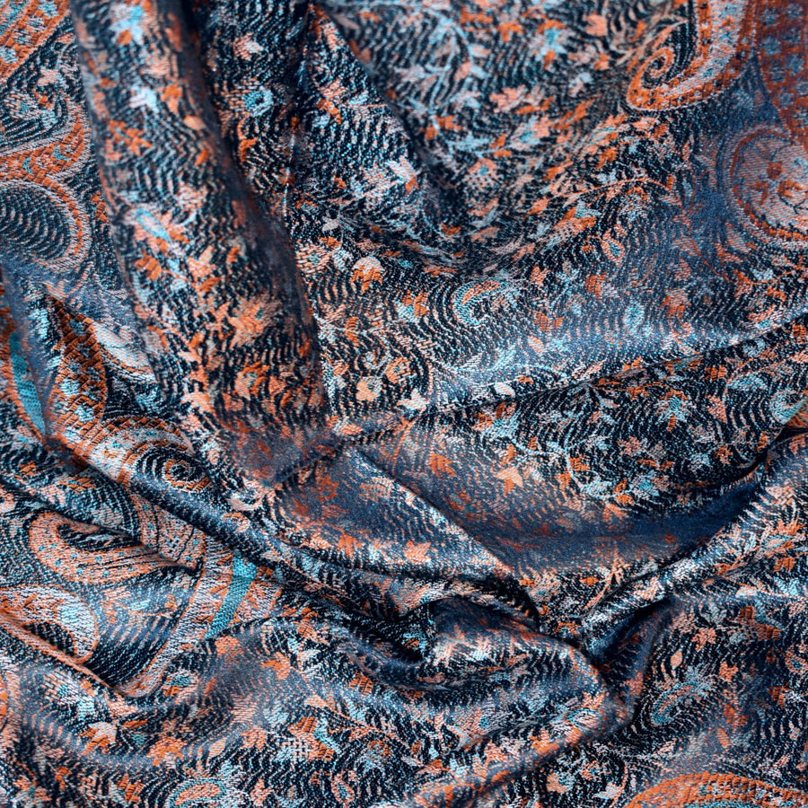 Close-up of patterned silk stole with blue and orange tones