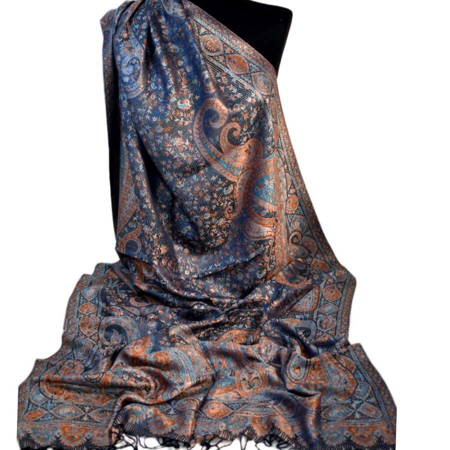 Patterned scarf on a black mannequin against a white background