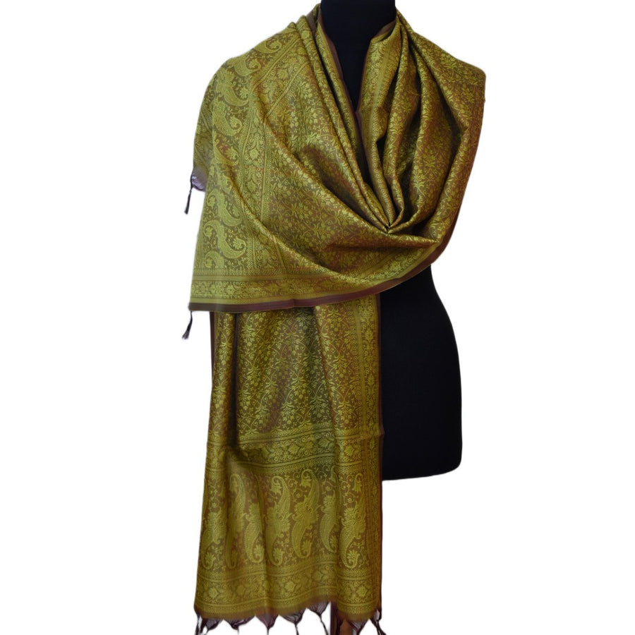 Green patterned scarf on a black mannequin against a white background