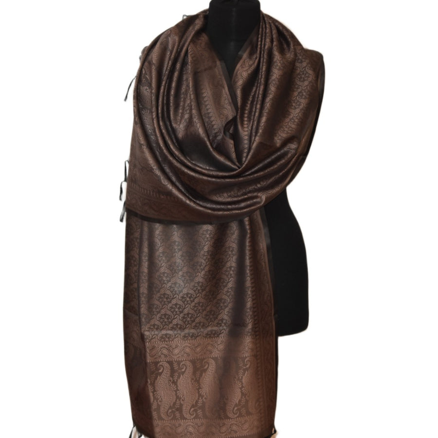 Brown patterned scarf on a mannequin against a white background