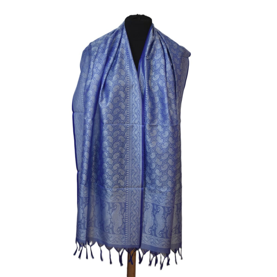Blue patterned scarf on a mannequin against a white background