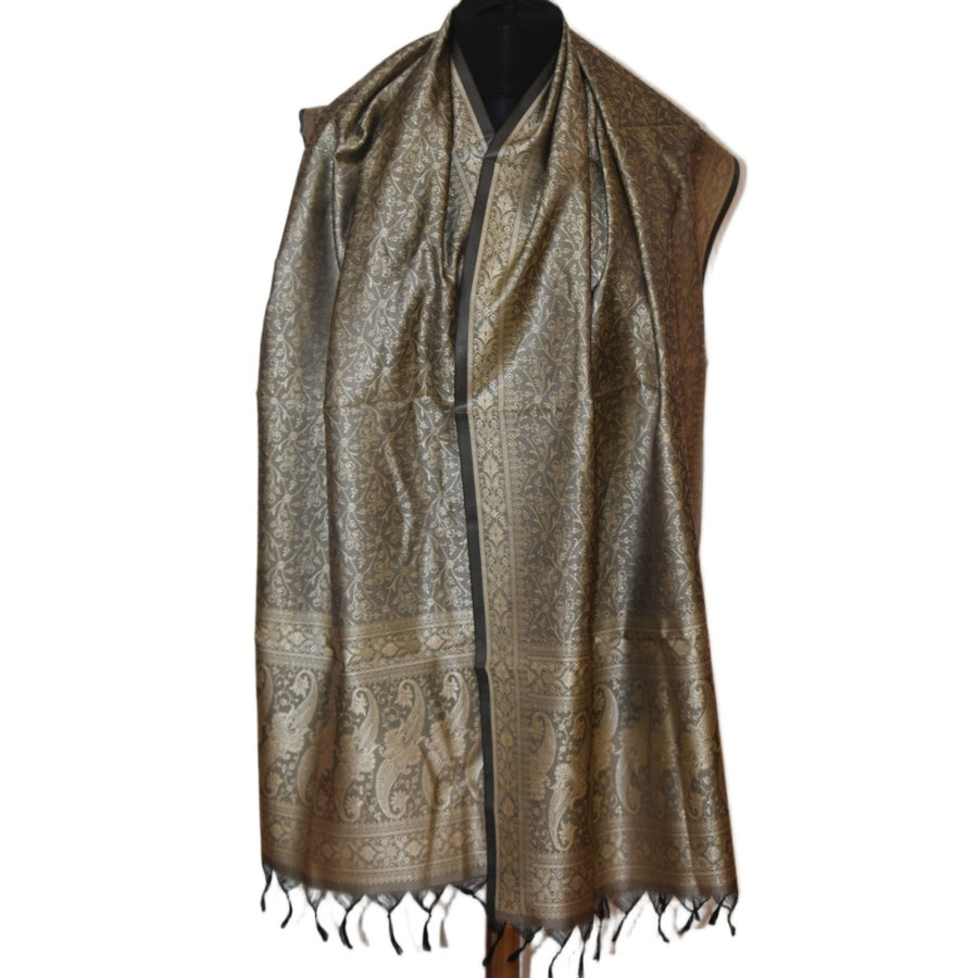 Brown patterned scarf on a mannequin against a white background