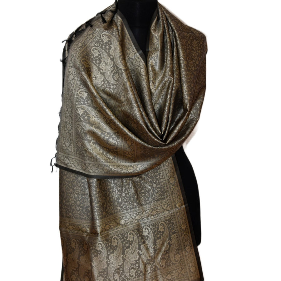 Brown patterned scarf on a mannequin against a white background