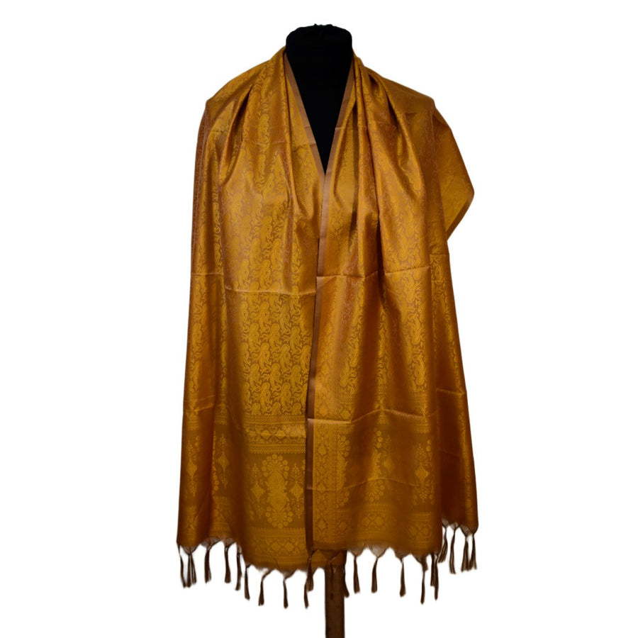Brown scarf with fringe on a mannequin against a white background