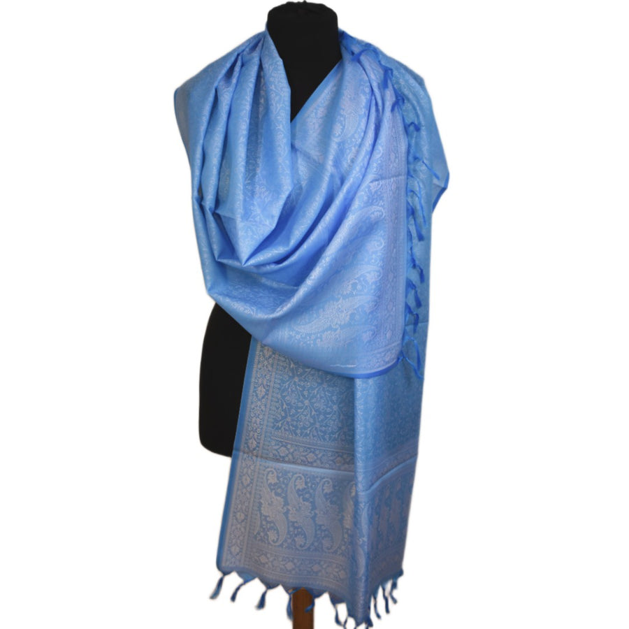 Blue patterned scarf on a mannequin against a white background