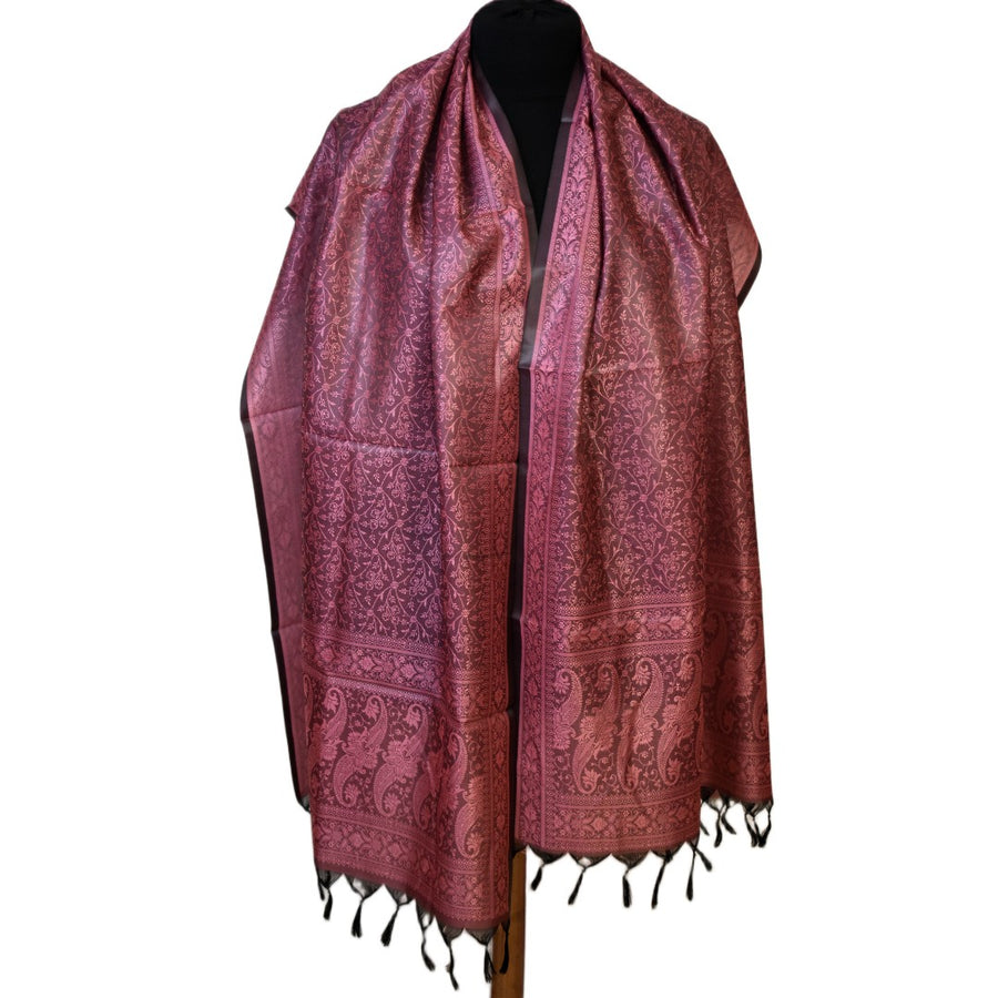 Red patterned scarf on a mannequin with a white background