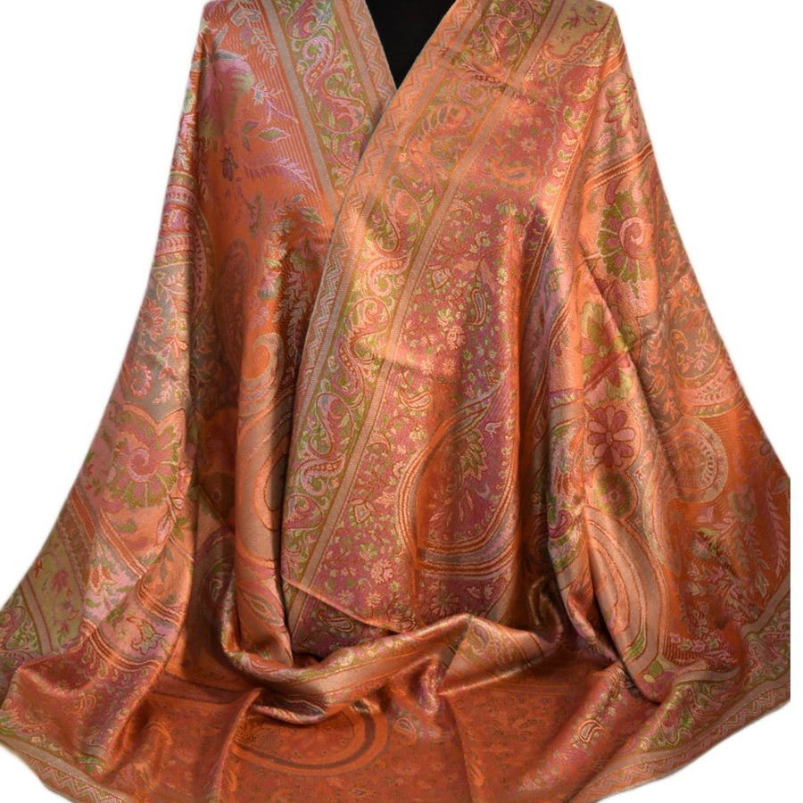 Pure silk shawlin shades of rusty orange brown and green on a white background