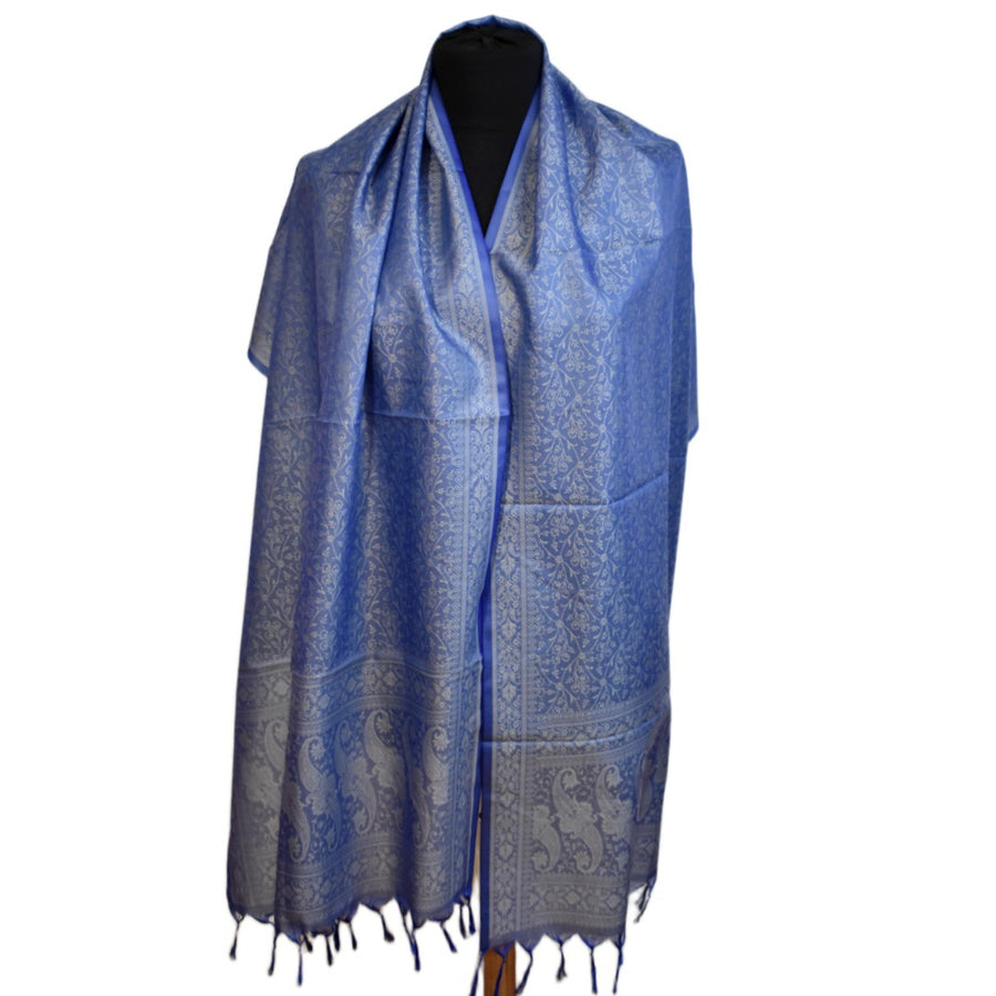 Blue patterned scarf on a mannequin against a white background