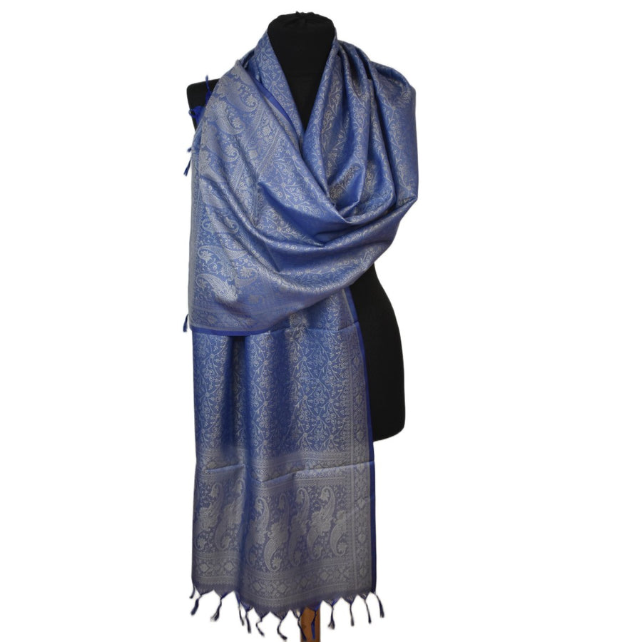 Blue patterned scarf on a mannequin against a white background