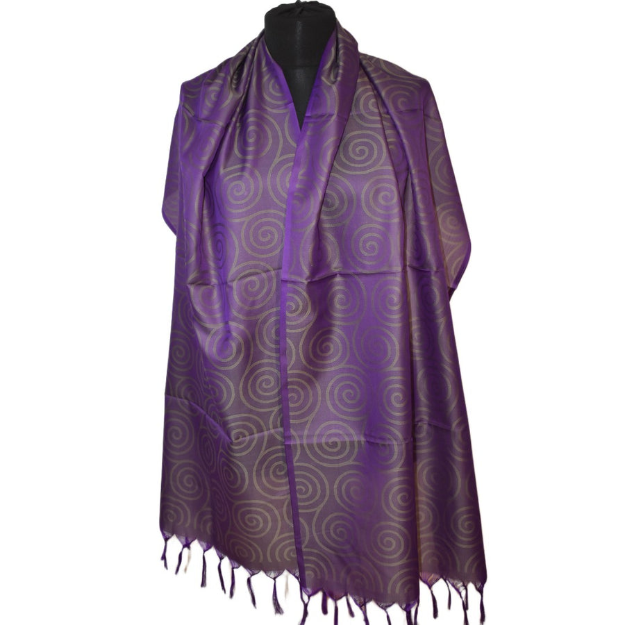 Purple scarf with white circular pattern on a mannequin against a white background