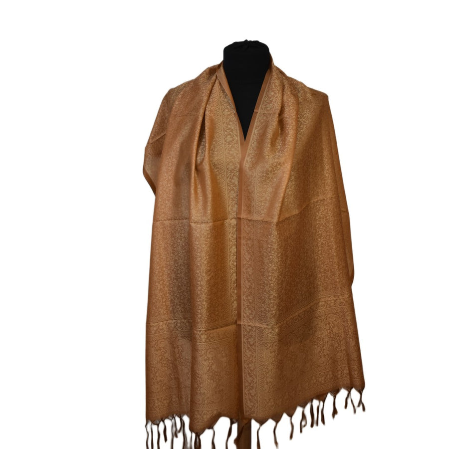 Brown scarf with fringes on a black mannequin against a white background
