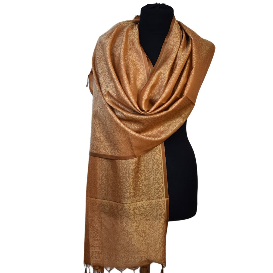 Brown scarf on a black mannequin against a white background