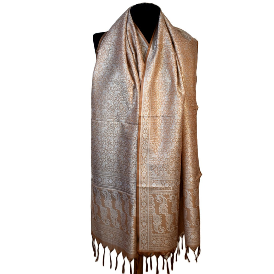 Patterned scarf with fringes on a mannequin against a white background