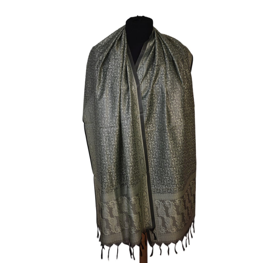 Patterned scarf on a mannequin against a white background