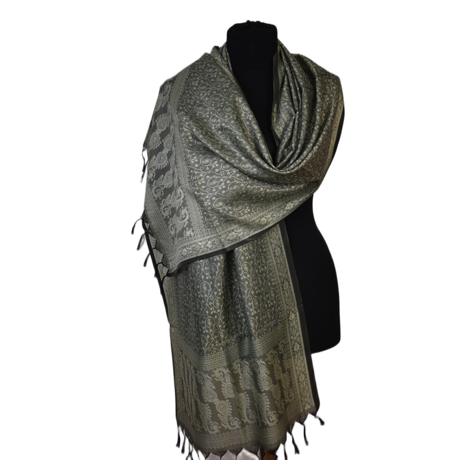 Patterned scarf on a mannequin against a white background