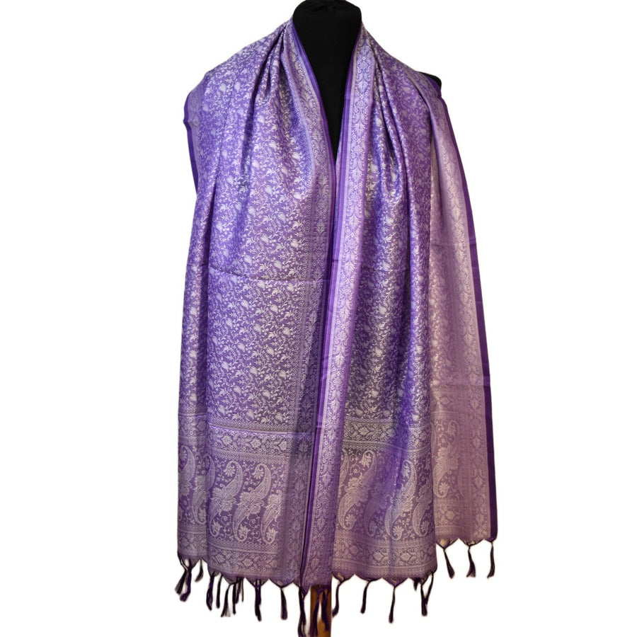 Purple patterned scarf on a mannequin against a white background