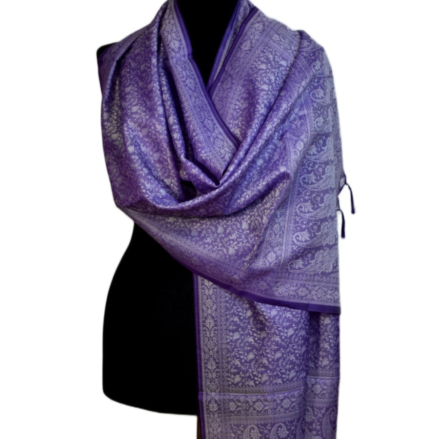 Purple patterned scarf on a mannequin against a white background