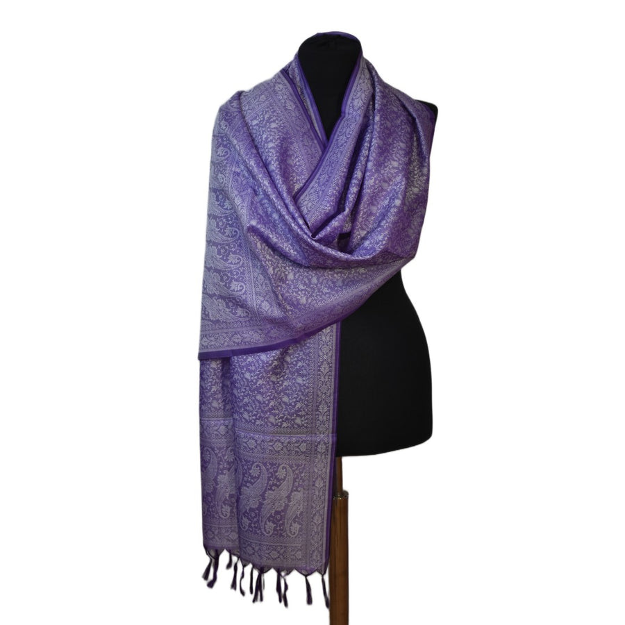 Purple scarf with intricate patterns draped over a black mannequin on a white background