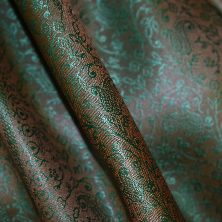 Close-up of patterned fabric with green and brown colors