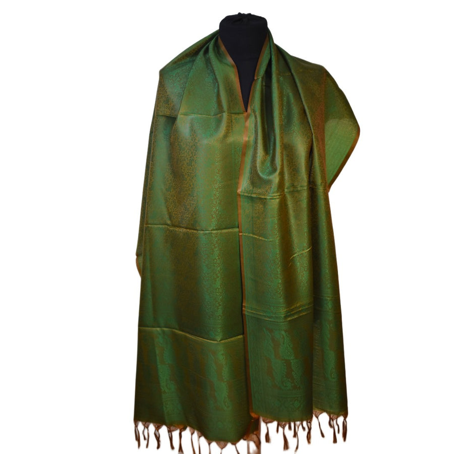 Green scarf with fringe on a mannequin against a white background