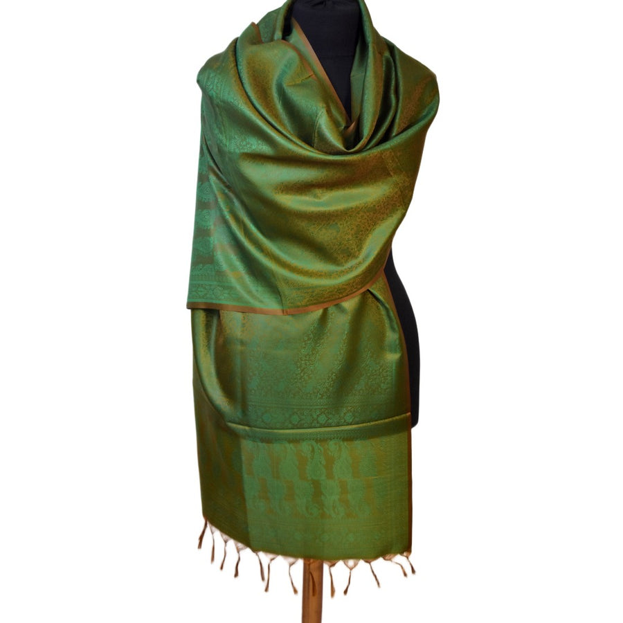 Green scarf with pattern on a mannequin against a white background