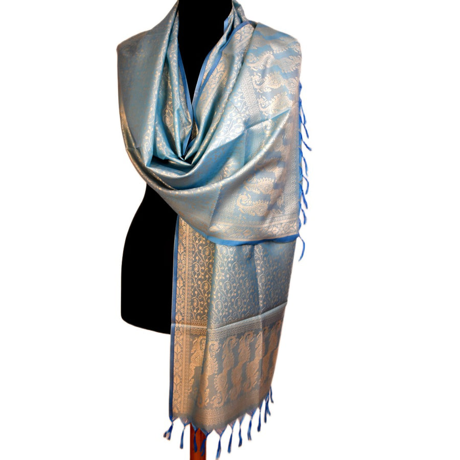Silver and blue patterned scarf on a mannequin with a white background