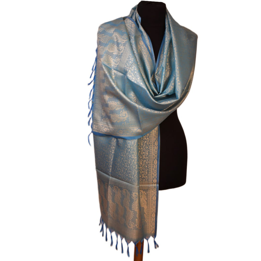 Blue and silver patterned scarf on a black mannequin against a white background