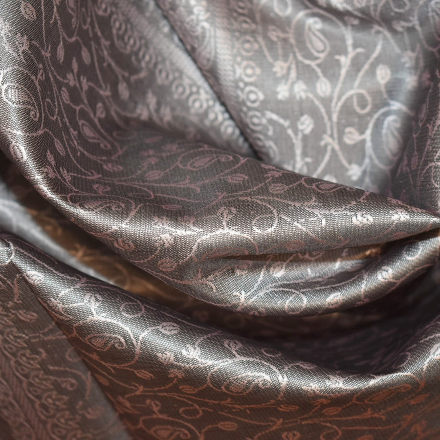Close-up of patterned fabric with intricate designs.