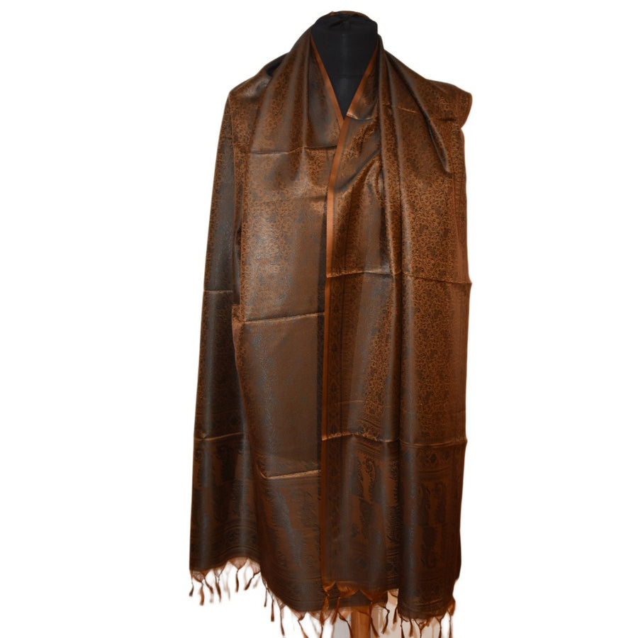 Brown scarf with fringe on a mannequin against a white background
