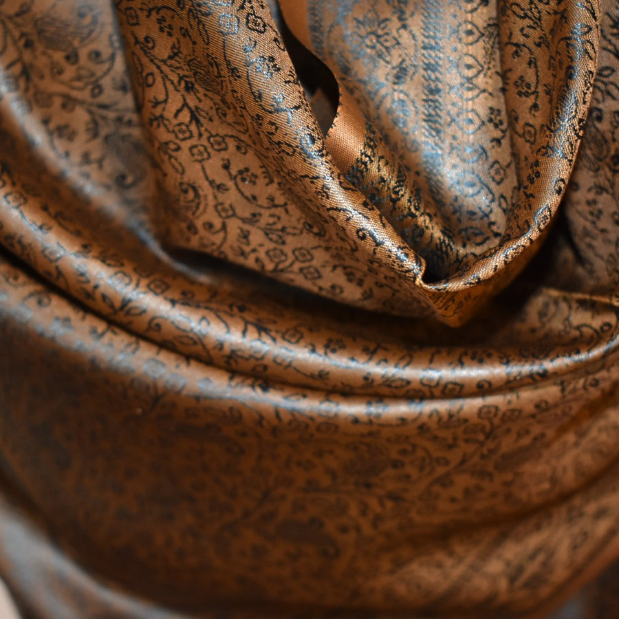 Close-up of brown fabric with intricate patterns