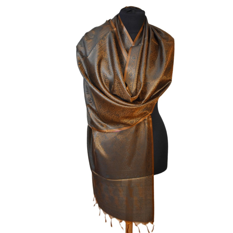 Brown patterned scarf on a black mannequin against a white background